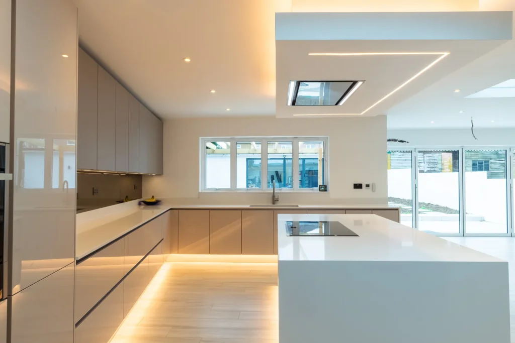 Signature cappuccino gloss kitchen with open-plan layout and mood lighting