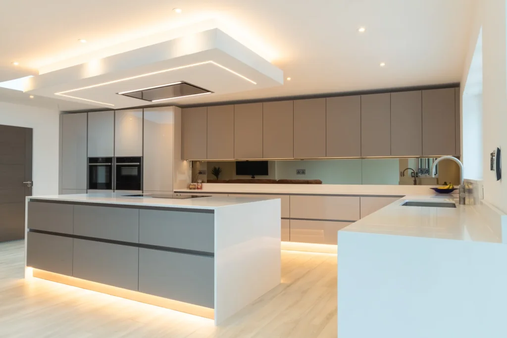 Signature cappuccino gloss kitchen with open-plan layout and mood lighting