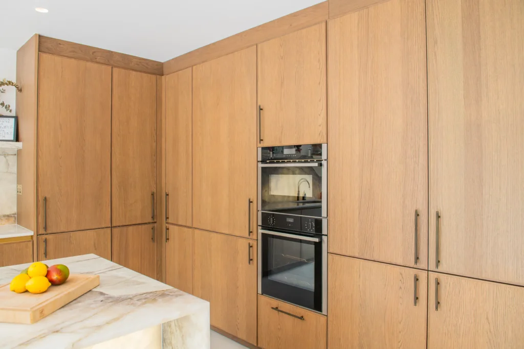 Artisan oak veneer kitchen with concealed walk-in larder and coffee station