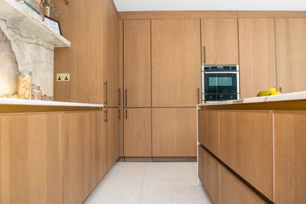 Artisan oak veneer kitchen with concealed walk-in larder and coffee station